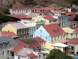 An arial view of the the Wellington house (the largest building, with a side façade of light blue) . located in the heart of Jamestown.