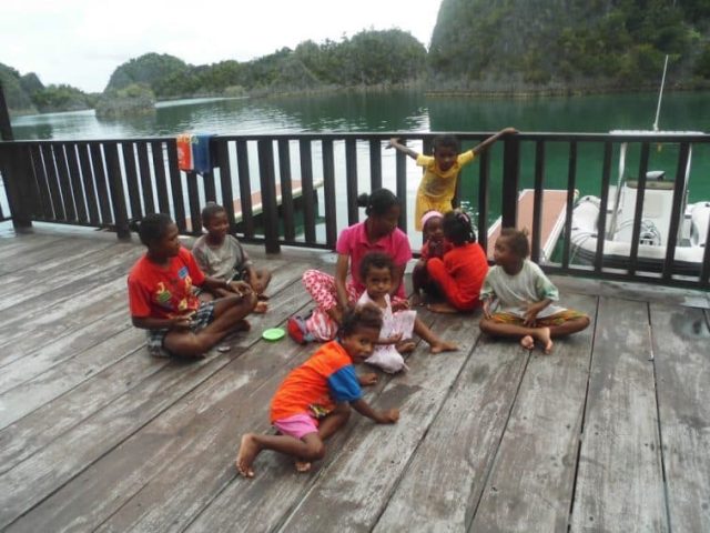 kids in the village Raja Ampat,Yacht cruising