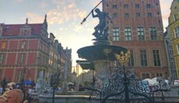 The 17th-century Neptune Fountain is a busy tourist gathering spot in Gdansk, Poland.