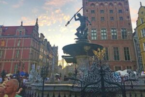 The 17th-century Neptune Fountain is a busy tourist gathering spot in Gdansk, Poland.