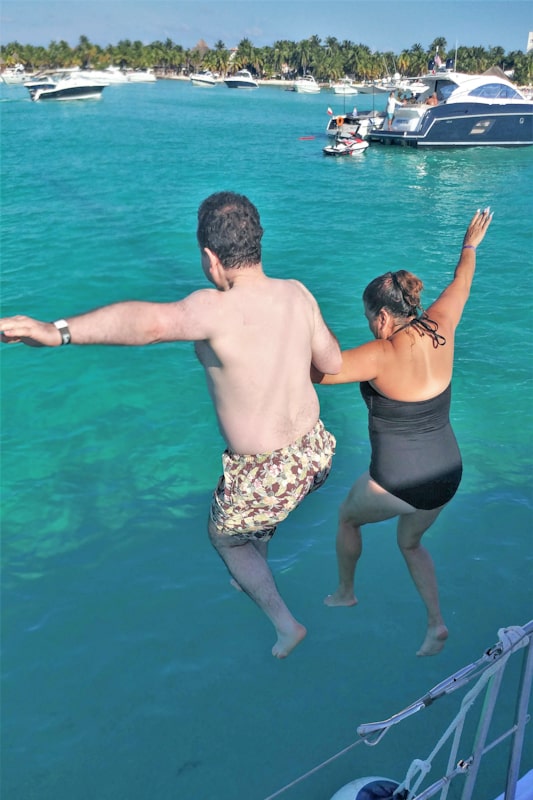 A leap of faith at Playa Norte Riviera Maya with Lisa and Bill.