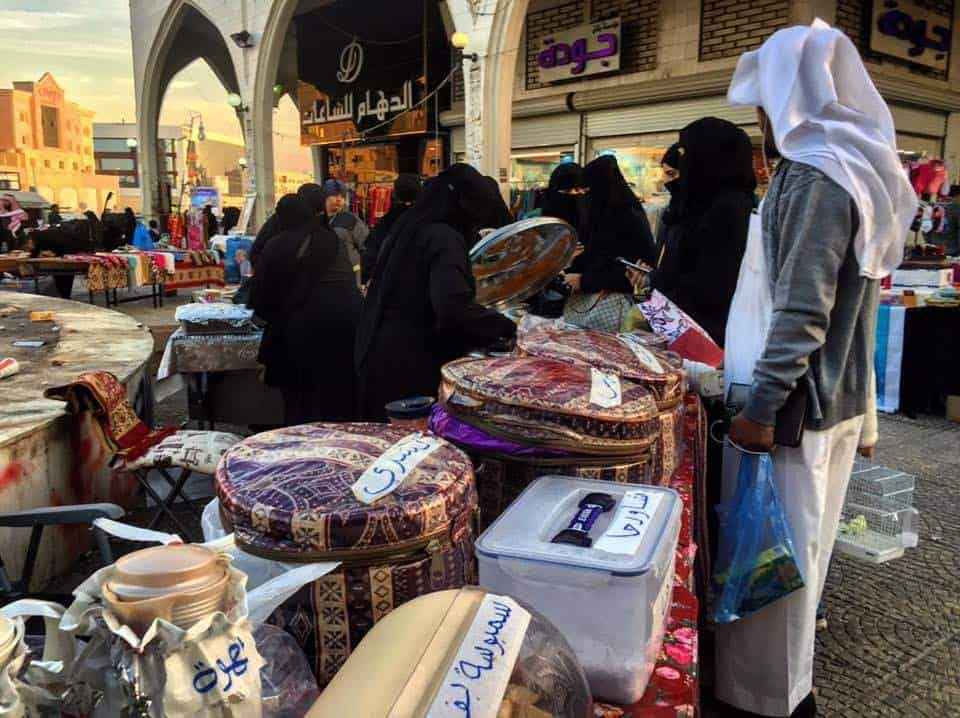 Women and men at the market in Riyadh, Saudi Arabia.