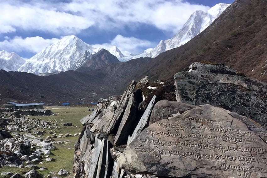 Mani walls in Dharmasala with Manaslu, Naike, and Larke Peak on the backdrop