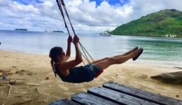 Michelle swinging after lunch on Taha’a, Tahiti. Aaron Pribble photos.