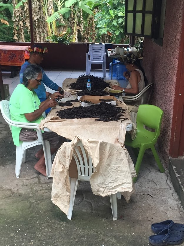 Workers processing beans at a vanilla farm on Taha’a. 