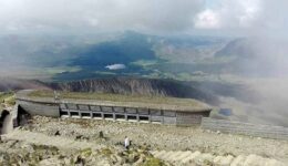 At the summit of Snowdon with a shot of its visitor centre amongst the Snowdonia grandeur.