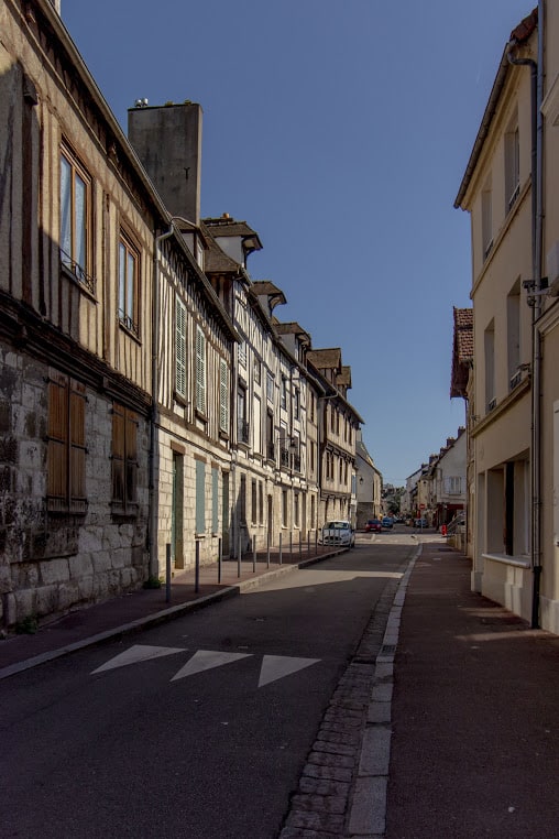 Shops of the “Rue of Claude Monet” heading to the local church