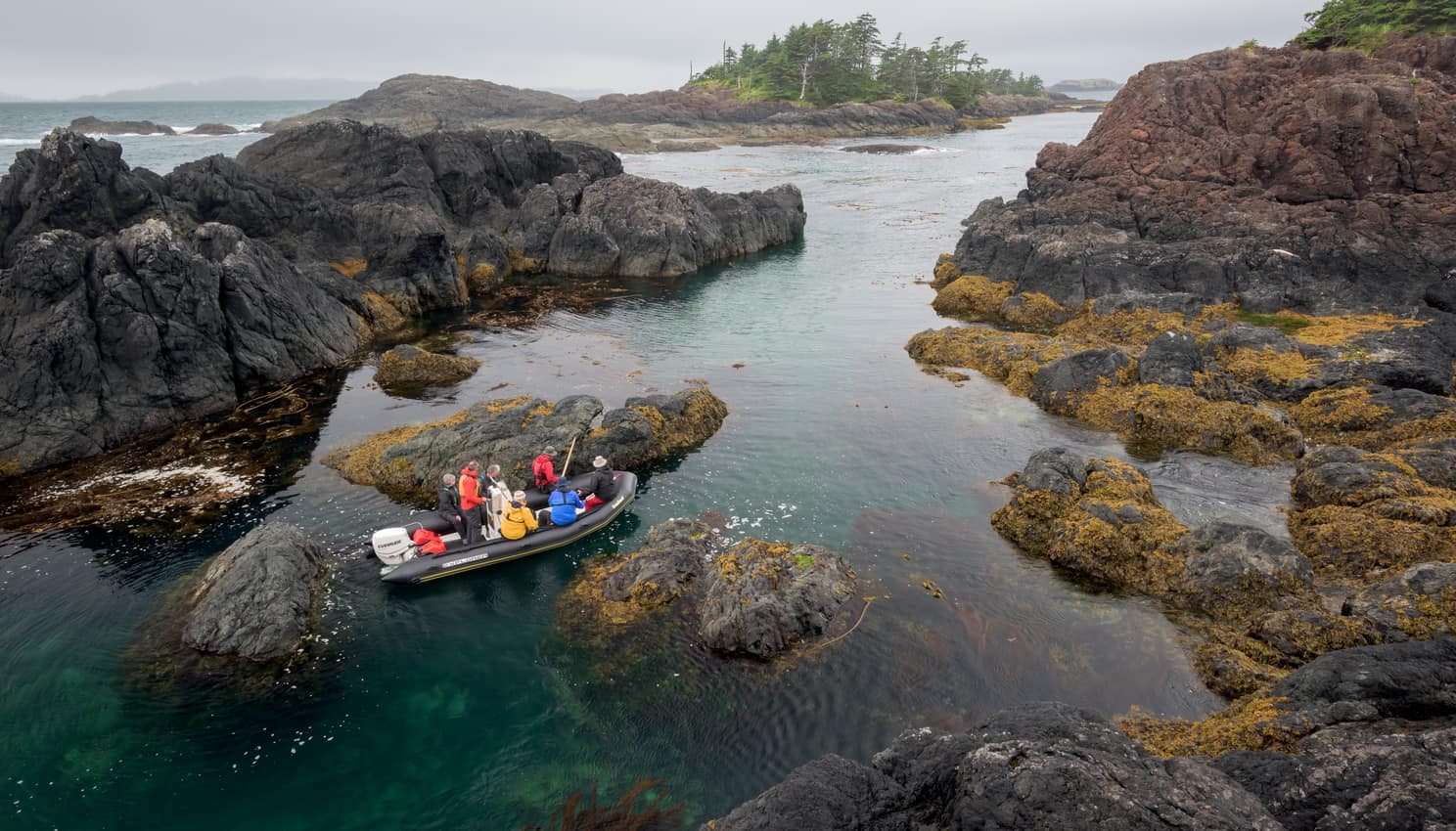 Passengers exploring some pools in a raft