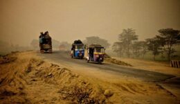 Rickshaws on a sandy road