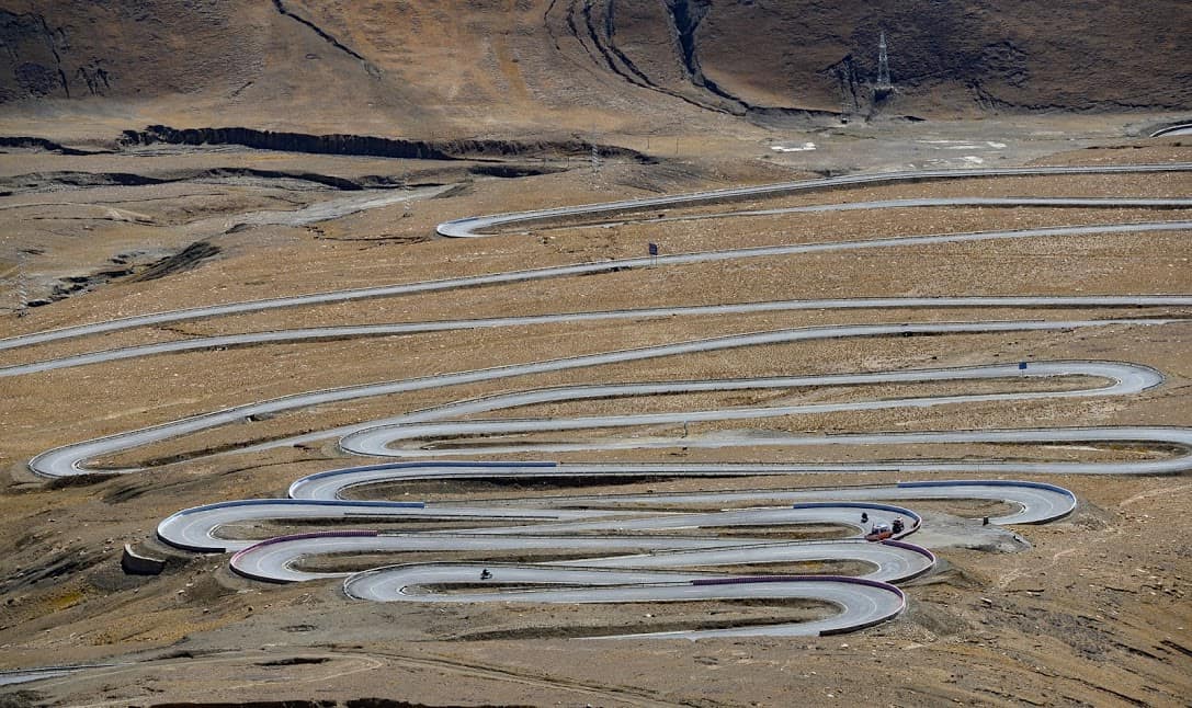 To say the Friendship Highway snakes up and down the mountain passes in Tibet is an understatement. Donnie Sexton photos.