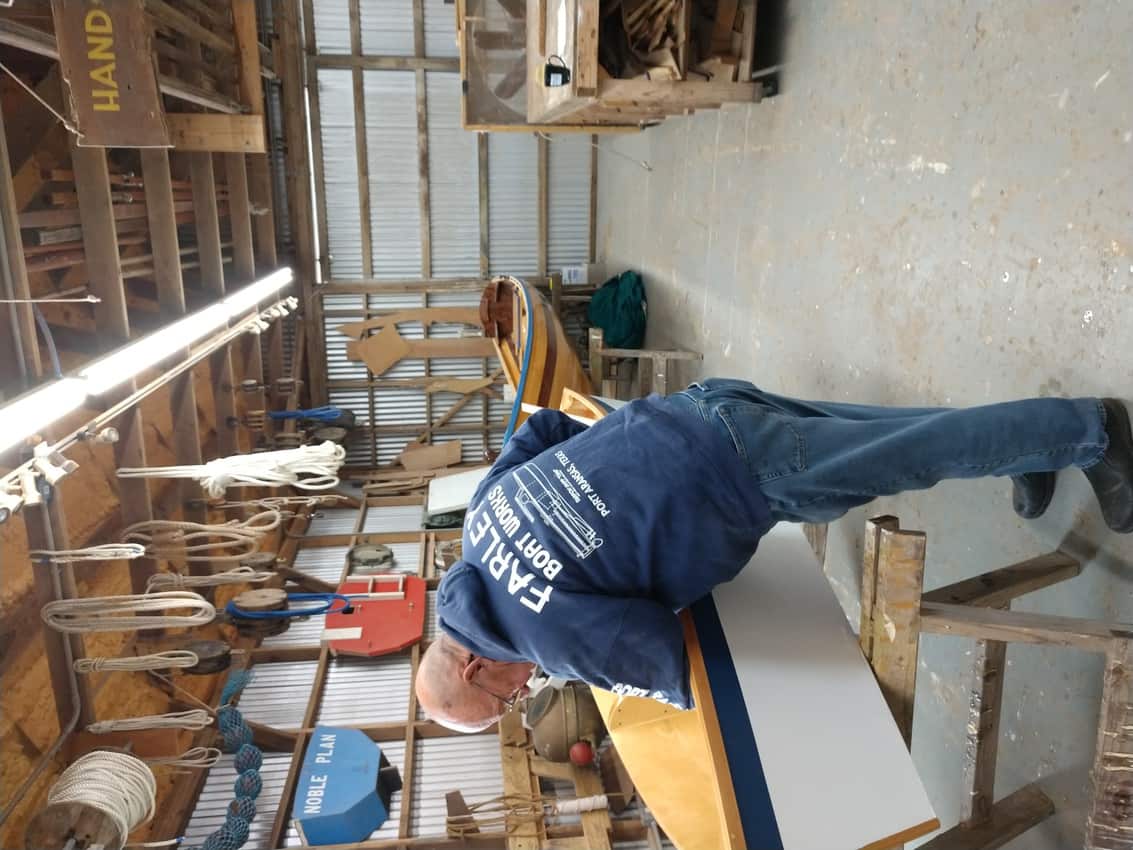 A man builds a boat at the historic Farley Boat Works in Port Aransas.