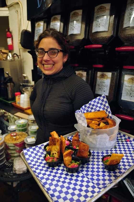 Kate Zaidan, owner of Mediterranean Imports, offers samples to visitors on Cincinnati Food Tours.