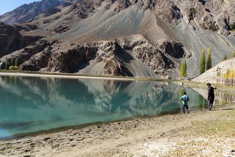 A man and his son fish for trout at Phander Lake on the last day of the season.