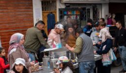 Street vendors preparing snail soup for a Moroccan family in the medina.