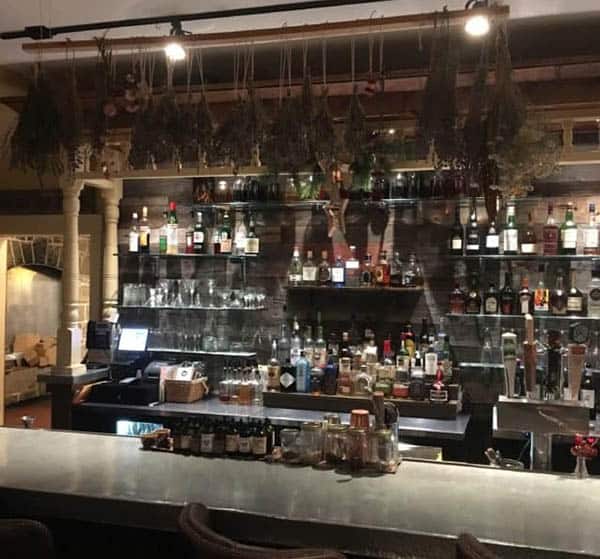 The bar of Table and Tonic, decorated with dried organic herbs.