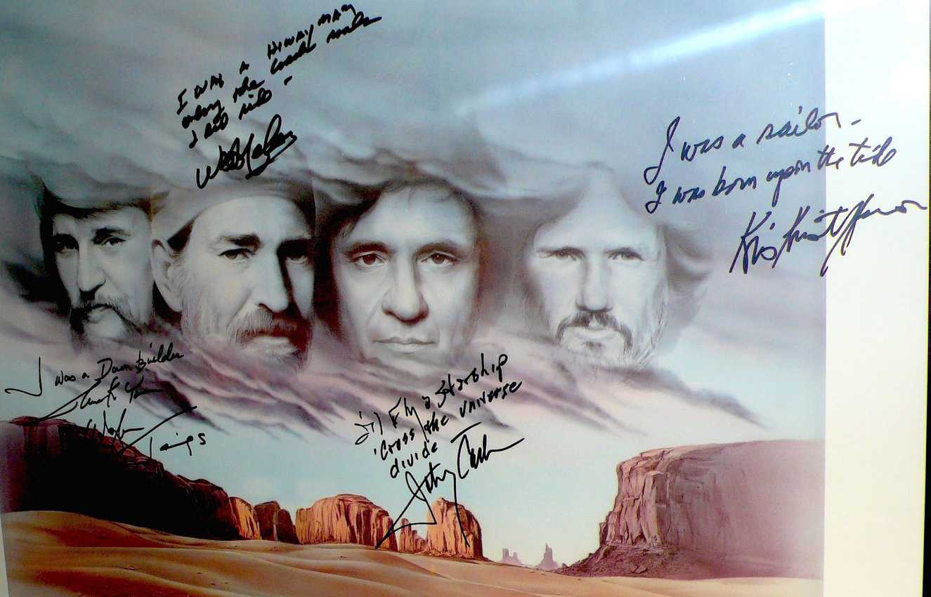 A photo of The Highwaymen displayed at the Johnny Cash Museum was signed by the musicians.