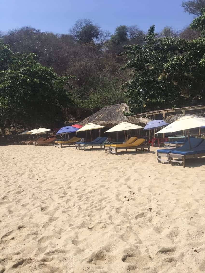 Empty beach chairs in Puerto Escondido.