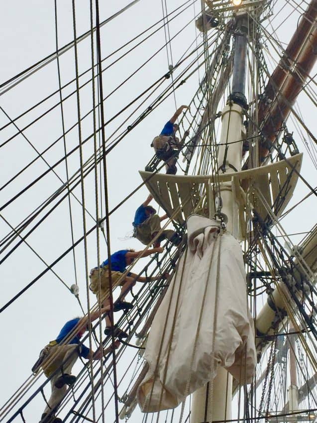 A well-trained volunteer crew sets the sails of the historic 1877 ELISSA tall ship. - Photo by Janis Turk