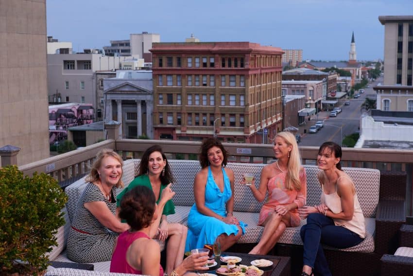 The Tremont House hotel rooftop bar offers gulf breezes and cool cocktails at sunset.