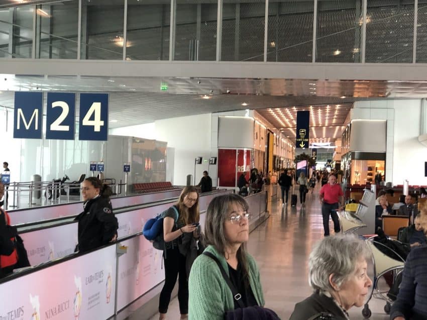 Passengers at Paris CDG airport. How do you squeeze into your seat in this age of social distancing? Max Hartshorne photos.