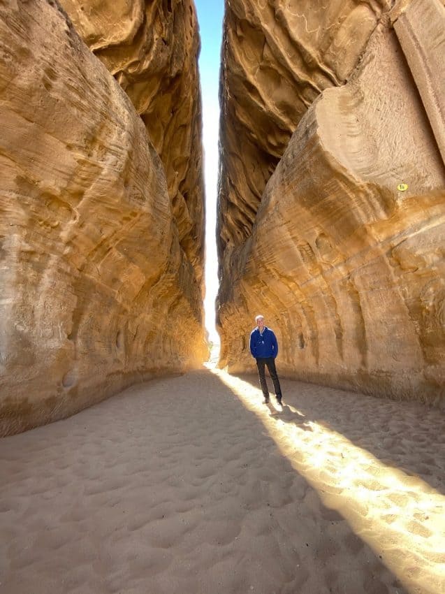 The author between some of the huge rock formations in Madain Saleh.