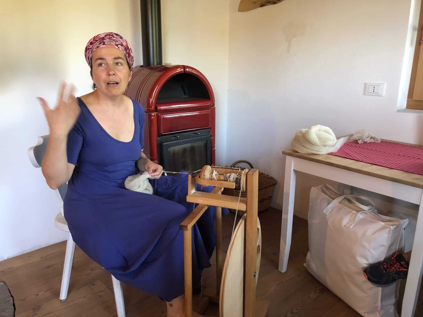 The proprietor of the Agriturismo, Vea, spinning wool at Agritur Mas Del Saro