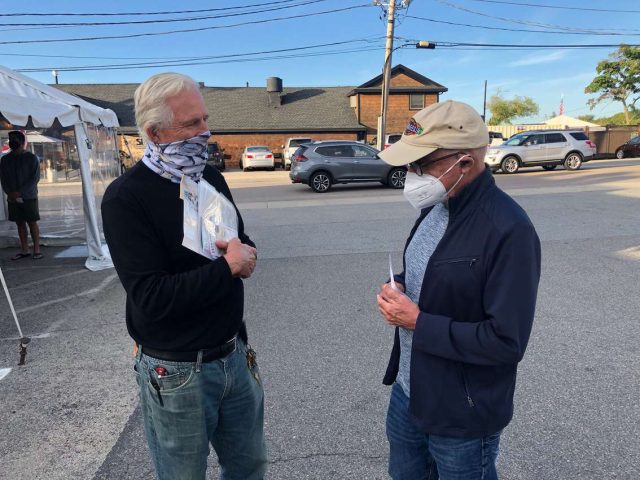 Steve Woodman with a customer Steve Woodman with a customer 1