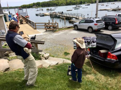 Round Pond Harbor in Bristol Maine at the entance to Muscongus Lobster Bay Co with Matt the artist