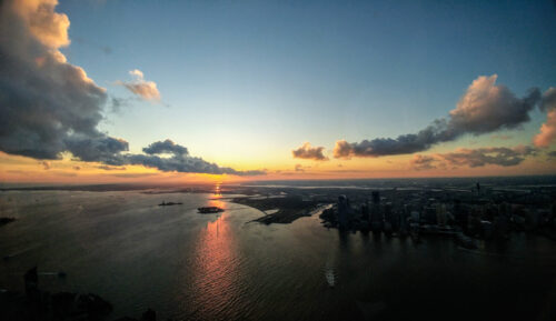 Sunset over New York Harbor on 102nd floor of One World Observatory.