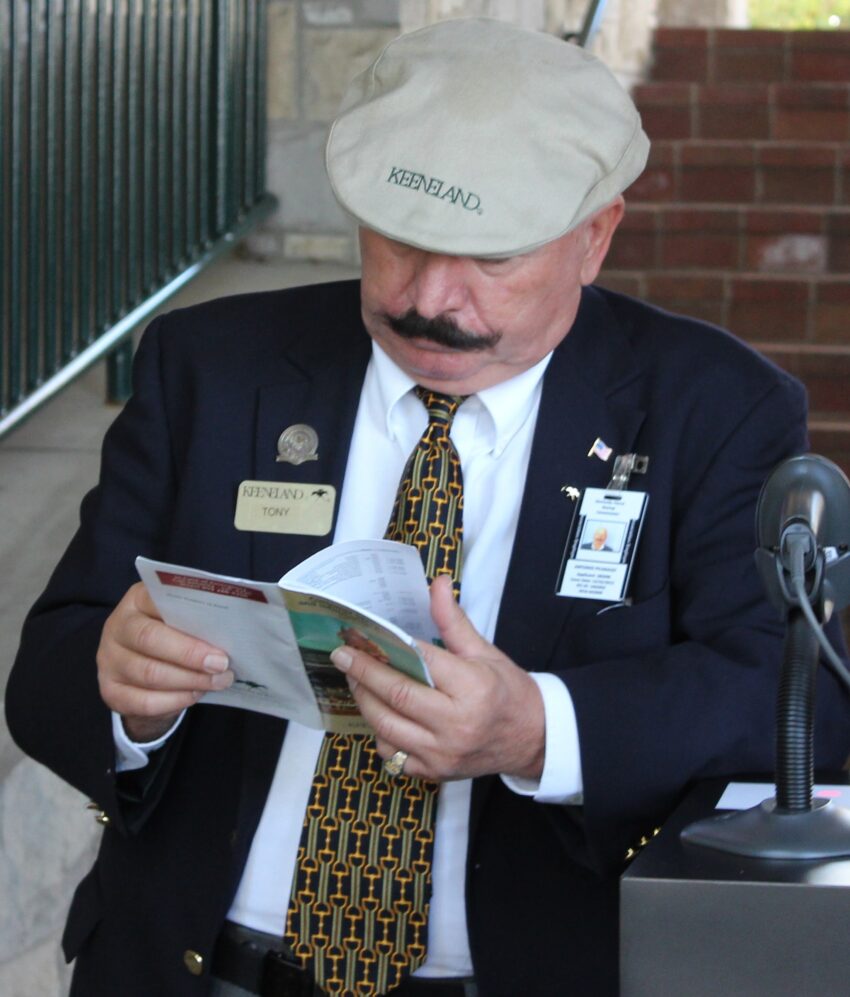 This fellow is contemplating the odds on the next Keeneland race.