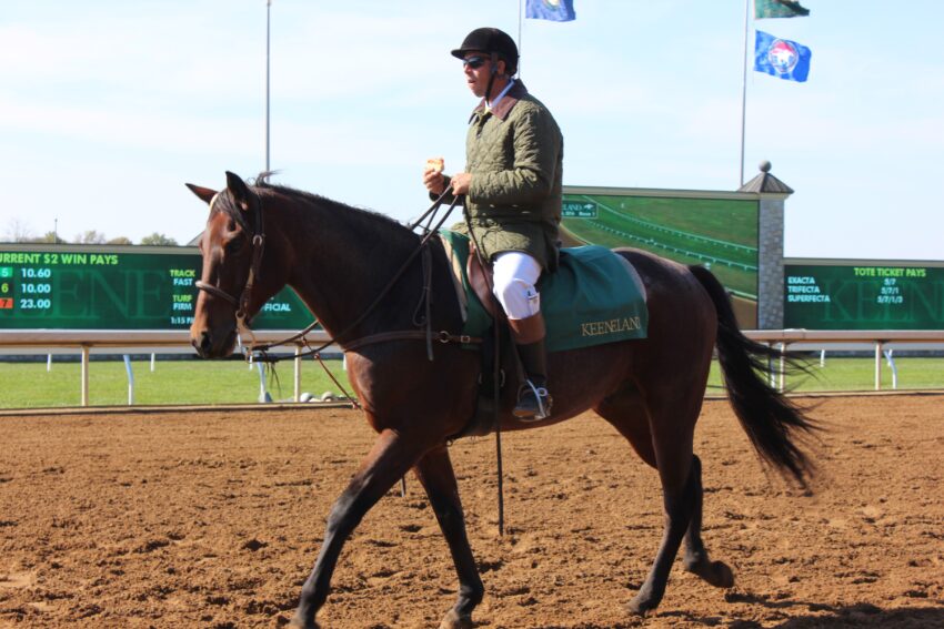 A rider at Keeneland Racetrack is getting ready for the next race.