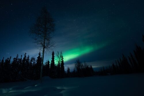 The aurora borealis is a result of the sun's electrically charged particles colliding with the earth's gases. The result is curtains of colored light.