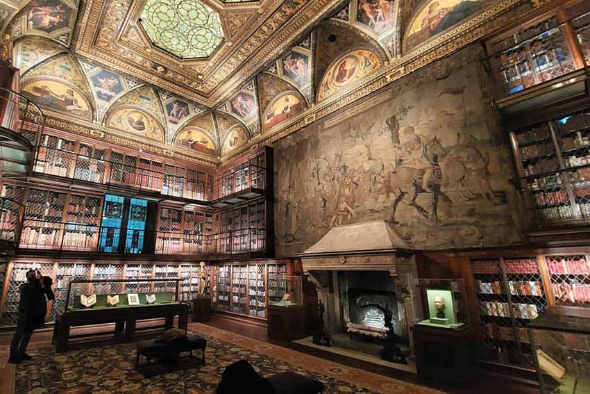 The vast East Room is Morgan’s original library, stacked with more than 11,000 rare books three stories high. Above the fireplace is the Triumph of Avarice tapestry once owned by King Henry VIII at the Morgan Library in NYC.