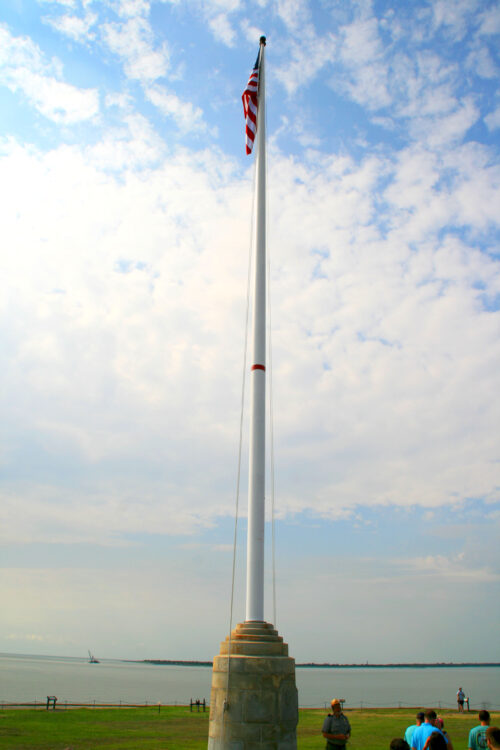 a red band around the flagpole several dozen feet above our heads marks the original height of the walls