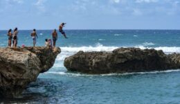Where the shoreline created a natural barrier from ocean swells safe enough for swimming, some locals took the opportunity to enjoy a bit of cliff jumping.