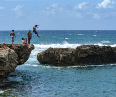 Where the shoreline created a natural barrier from ocean swells safe enough for swimming, some locals took the opportunity to enjoy a bit of cliff jumping.