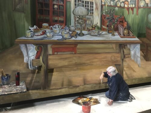 Sharon Lambert paints a set backdrop for Pageant of the Masters. Photo courtesy of Pageant of the Masters. 