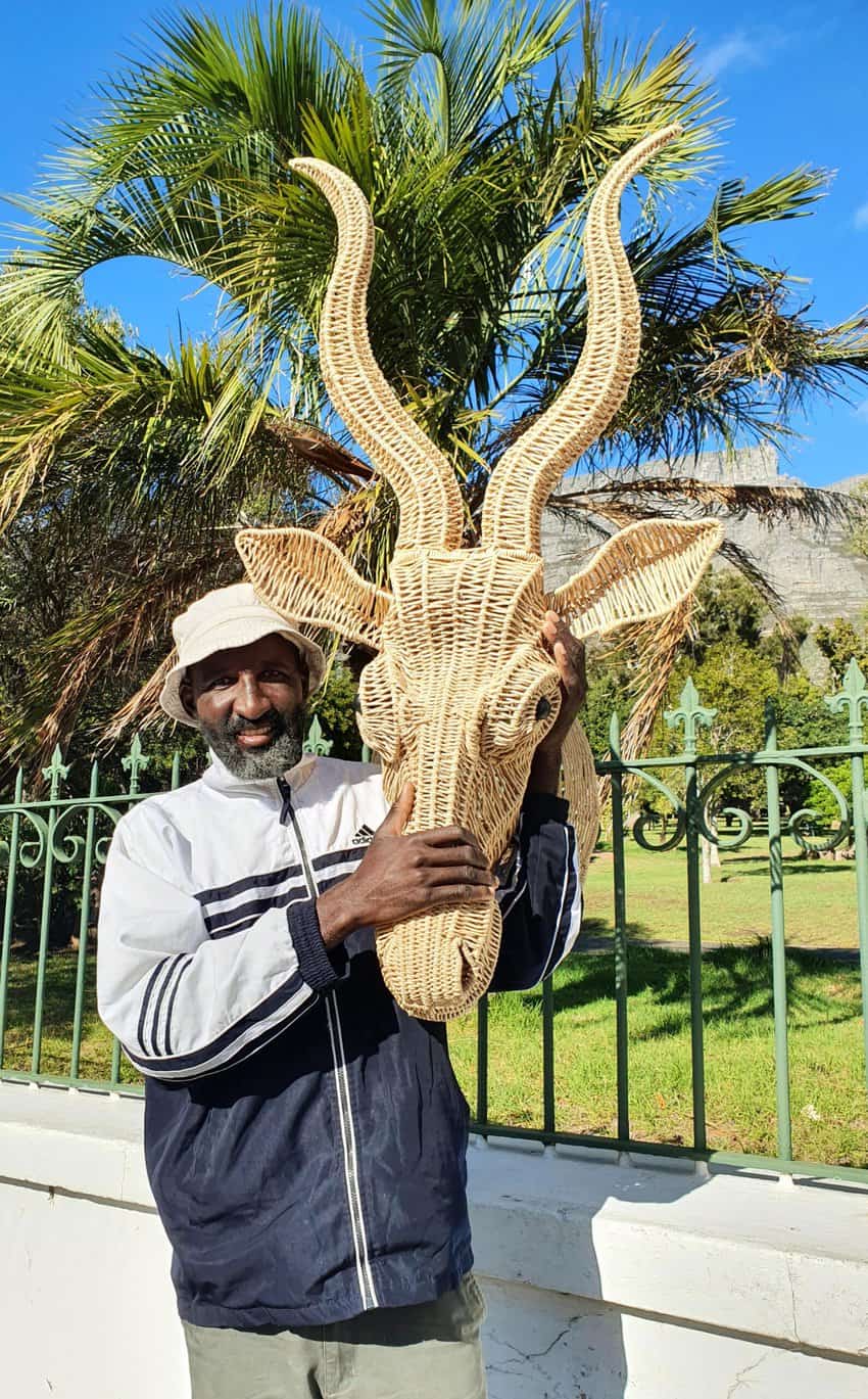 Jabu, an artist from Zimbabwe, sells reed animal heads on the streeta of Cape Town. This particular antelope head journeyed home to Italy with me.