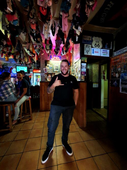 Quaint West Coast Fishing Villages of South Africa 4 An eager to pose customer at the Panty Bar, gicing me the 'safe my bro' thumb and pinkie.