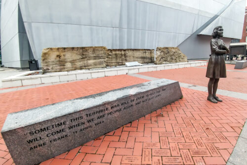 Outside, on the National Museum's grounds, dedicated bricks pepper the ground among bronze statues of notable wartime figures, like Anne Frank.