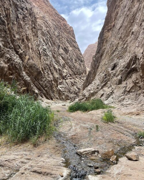 Wadi Tiyep Asm, a green oasis that emerges through two massive mountains.