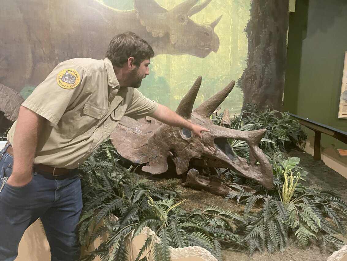 Riley Bell, park manager at Makoshika State Park, points out the skull of a triceratop found at the state's largest state park.