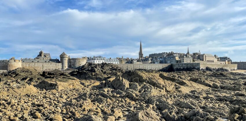 At low tide, the walls of Saint-Malo are drydocked by a sea of rocks. You can walk the walls of Saint-Malo, which are about a mile long on the ramparts, with an amazing town of twisting cobblestone streets and cafes inside in the old town.