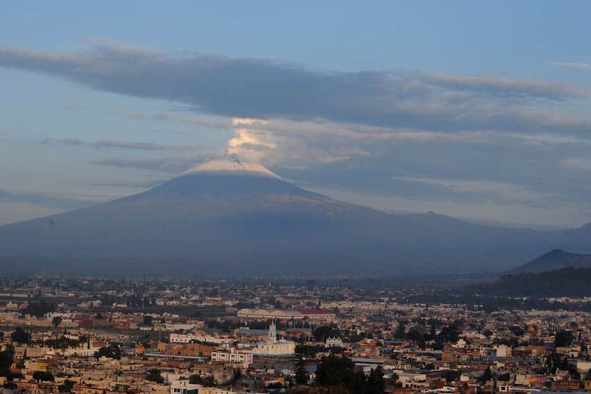 Erupting Popocatépetl and the town of Cholula.