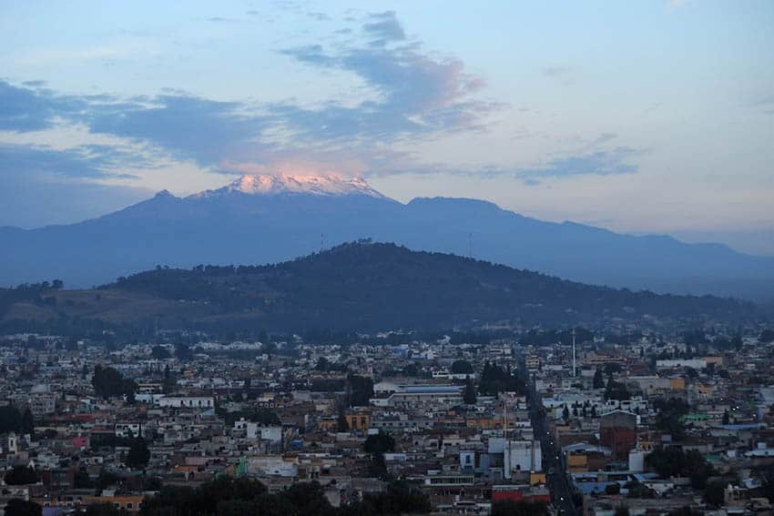 Cholula: Mexico's Very Big Archaeological Site 3 Iztaccíhuatl and the town of Cholula at sunrise.