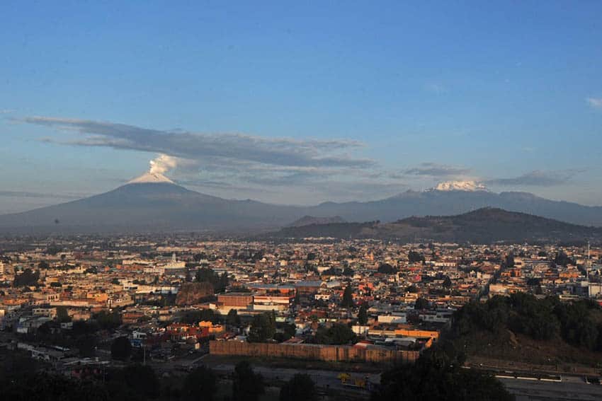 Cholula: Mexico's Very Big Archaeological Site 5 Popocatépetl and Iztaccíhuatl with the town of Cholula.
