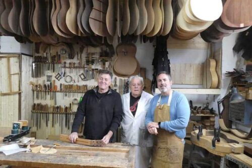 Manuel Bellido in his studio flanked by his two sons.