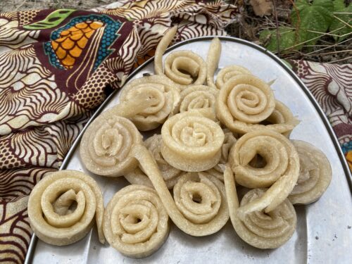 Miondo is a traditional Cameroonian side dish, and is pounded cassava pressed into thin strips and eaten with a choice of protein.