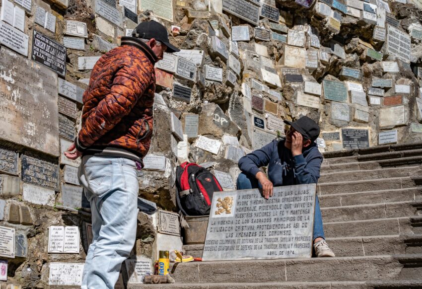 Marble and metal plaques cover the rock walls on the walk down to the Santuario de Las Lajas church.