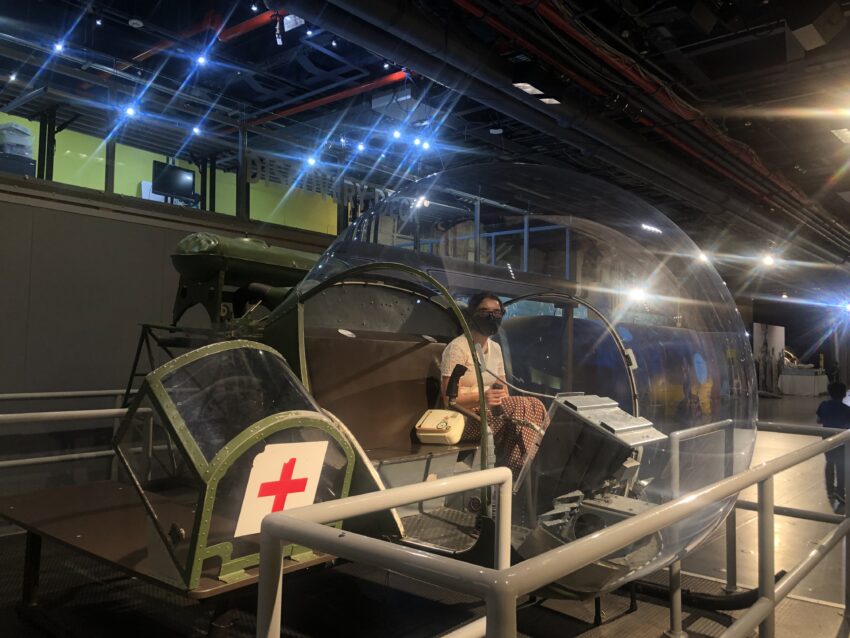 Enjoying a moment inside a helicopter in the Exploreum Interactive Hall at the Intrepid Museum.